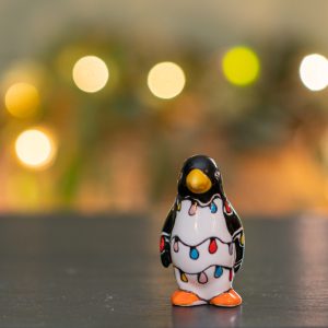 Festive penguin ceramic Christmas ornament