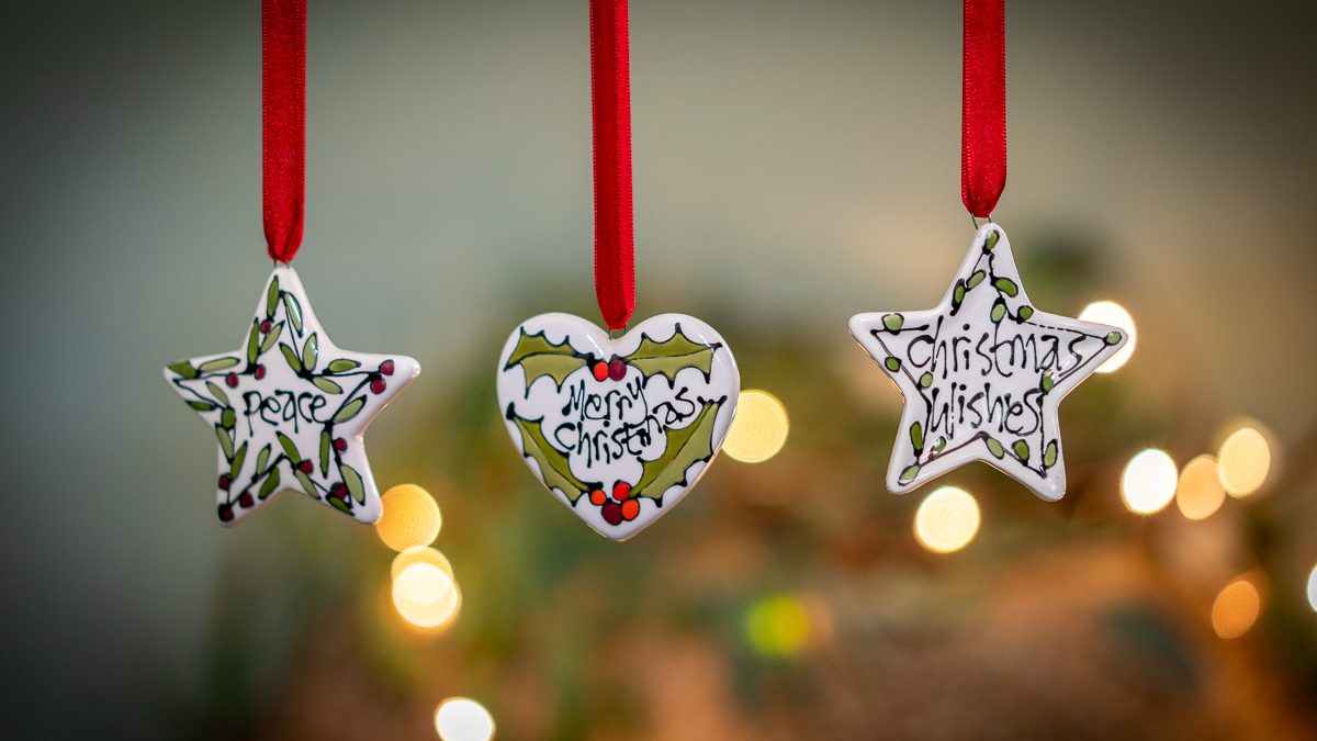 Hand-decorated ceramic Christmas stars and heart decorations by Gallery Thea