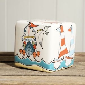 Coastal money box with Fishing boat, sailing boats, beach hut and seagull design