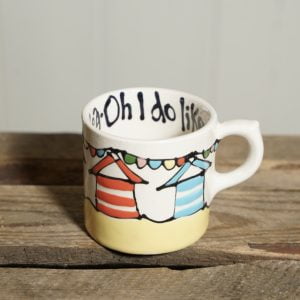 Oh I do like to be beside the sea espresso cup with beach hut and bunting design