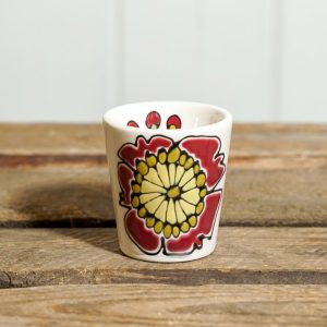 Egg cup with red flower